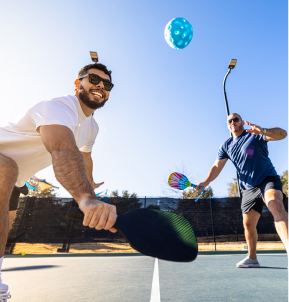 Two men playing pickleball at the new Aline District park.