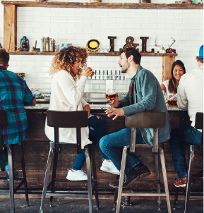 A couple has a Colorado Craft beer at a new restaurant.
